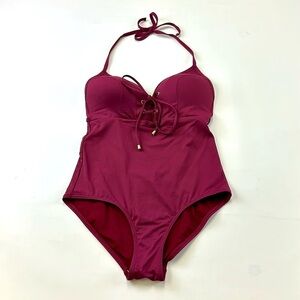 Nip Tuck burgundy swim suit one piece Fits 6-8 bathing suit
NWOT
